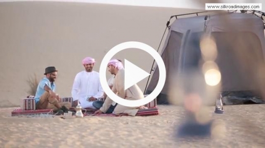 Friends playing cards in wilderness