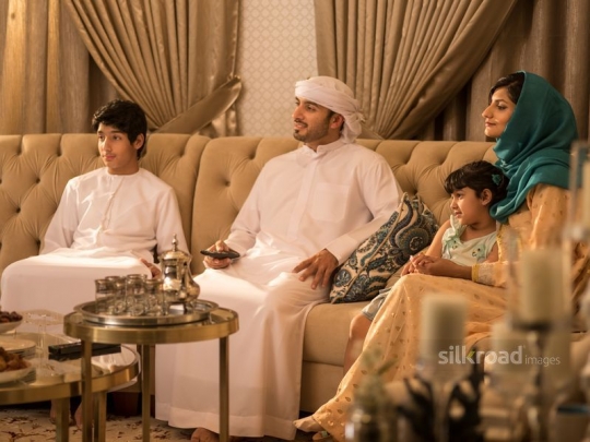 Family watching tv|-