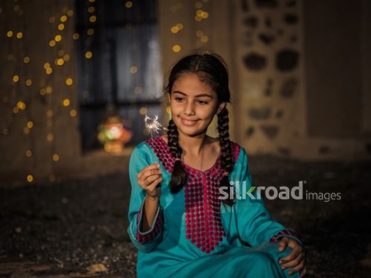 Girl celebrating with glowing matches|-
