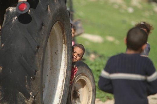 Happy little boy is playing with him brothers.