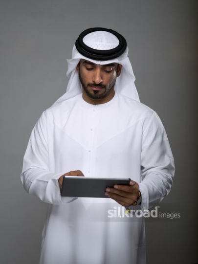Arab Businessman working on device