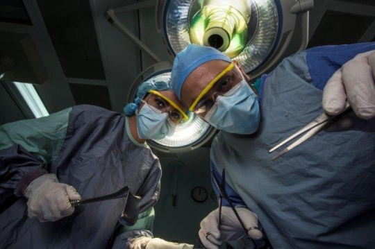 A Surgeon Holding Scissors at Operation Room