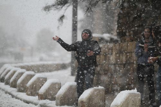 Fresh snow cover, at winter in Palestine, everbody happy and outside and play in the snow