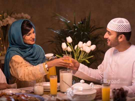 Couple sharing drinks|-