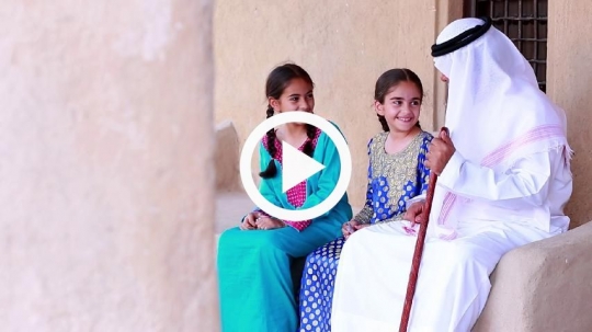 Kids celebrating Eid with grandfather