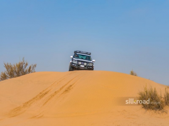 Car cruising in the sand dunes