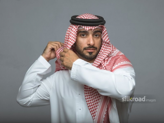 Arabian man fitting his head cover
