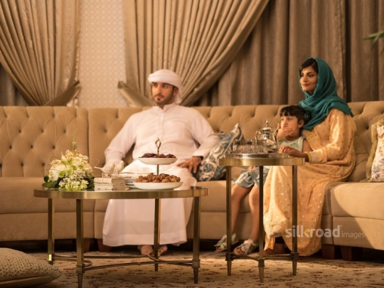 family on sofa watching TV|-