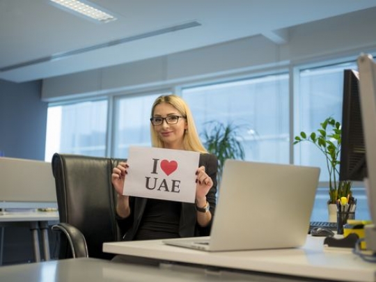 Woman celebrating National Day at the office|