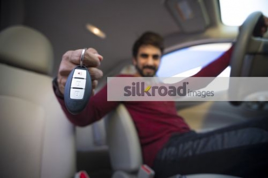 Asian man inside the car|