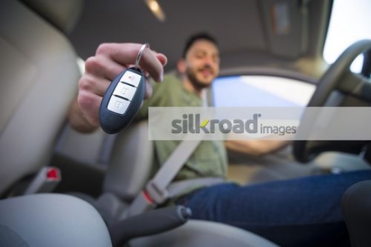 Young Arab boy inside the car|