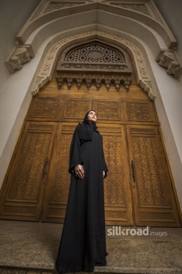 Low Angle shot of a Middle Eastern Businesswoman dressed in the traditional attire|-