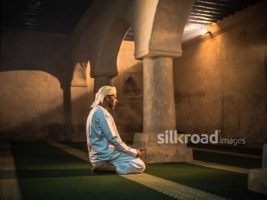 Man praying at the mosque|-