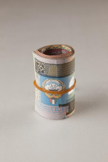 kuwaiti dinars rolled up