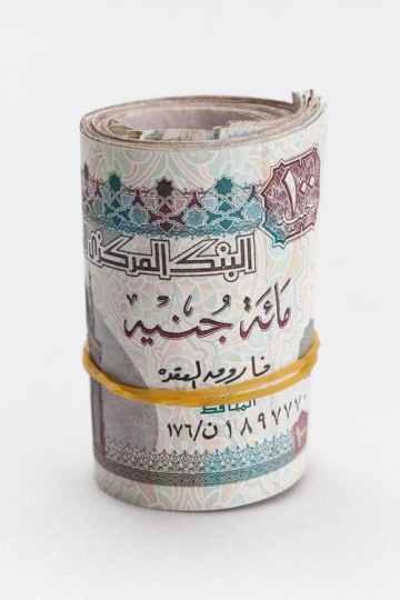 an egyptian money rolled up