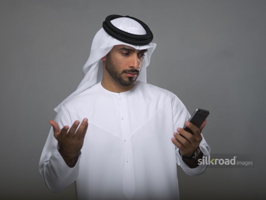 Businessman checking his mobile