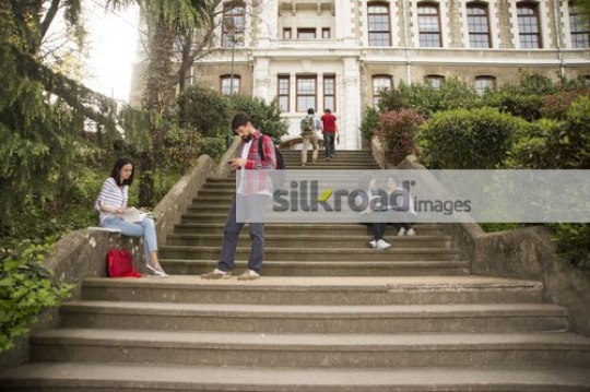 University Students scattered around campus|