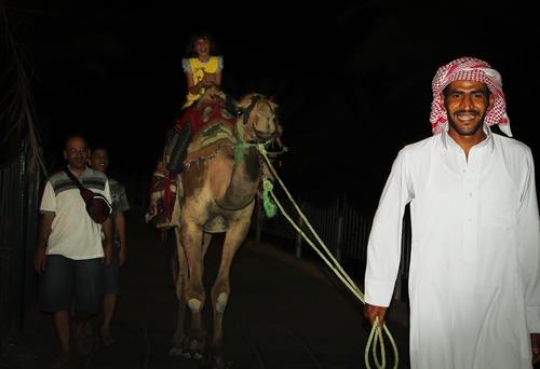 tourists riding a camel
