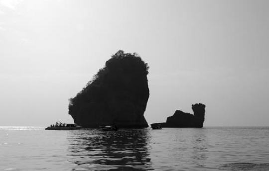 black and white cliff in the sea