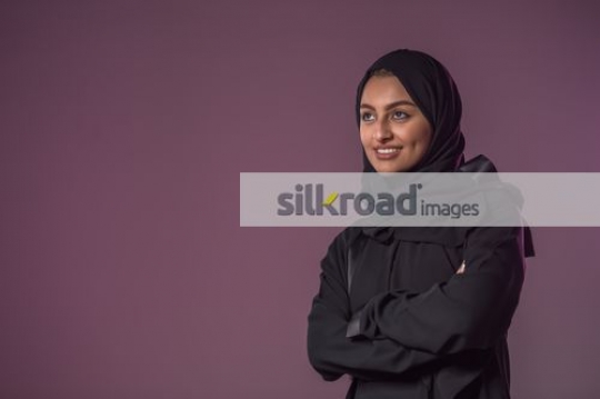 Middle Eastern woman arms crossed