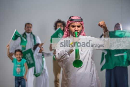 Group of people proudly celebrating their country|