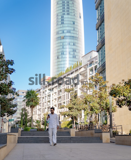 Professional Man Walking Through Al Abdali Boulevard, Amman