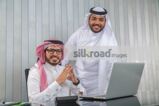 Businessmen at the office desk|