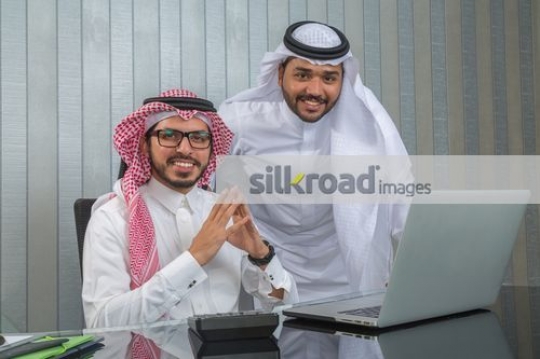 Middle Eastern Businessmen at the office desk|