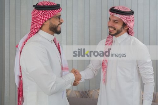 Middle Eastern Businessmen shaking hands|