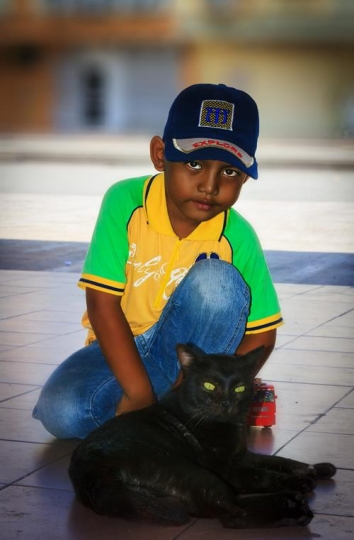 kid and black cat