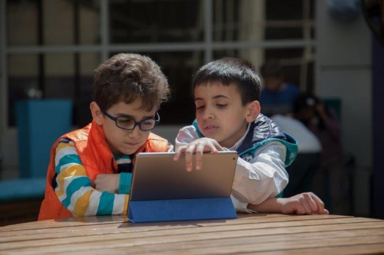 Boys Browsing Smart Tablet