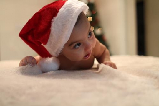 cute baby girl lying on her belly