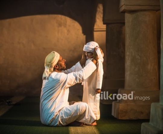 Old man with kid at the mosque|-