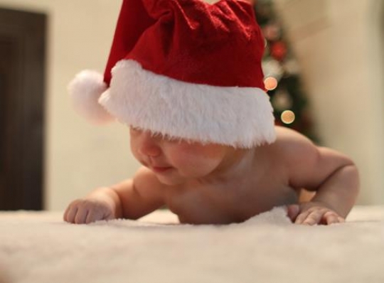 cute baby girl lying on her belly