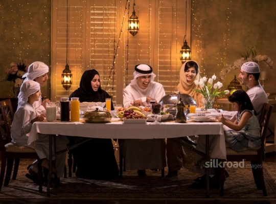 Happy family gathered for iftar|-