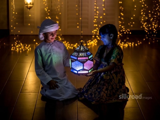 Brother and sister enjoying ornaments|-