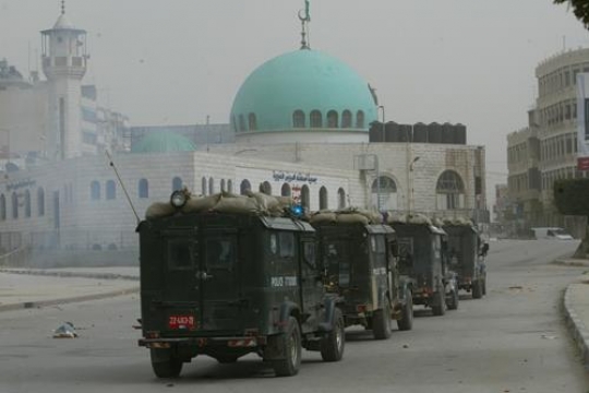 A convoy of Israeli police cars