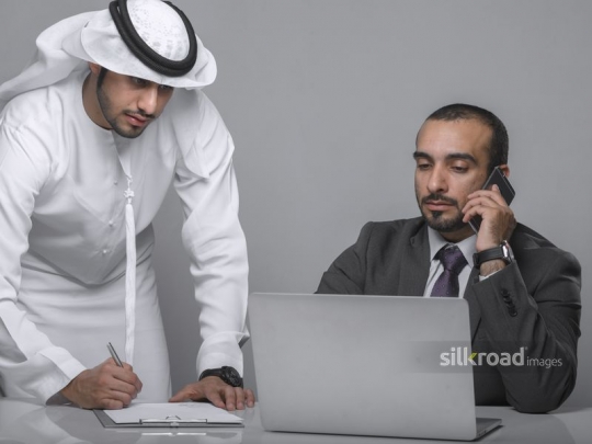 Middle Eastern Employee with manager