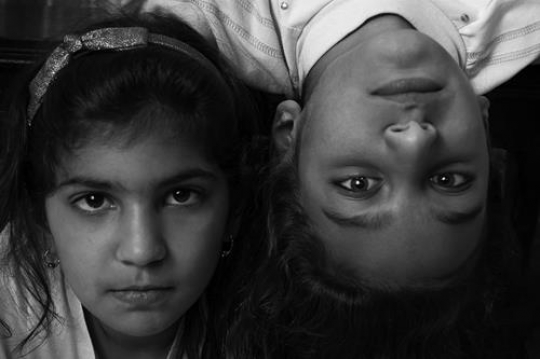 over head close up portrait of two young girls