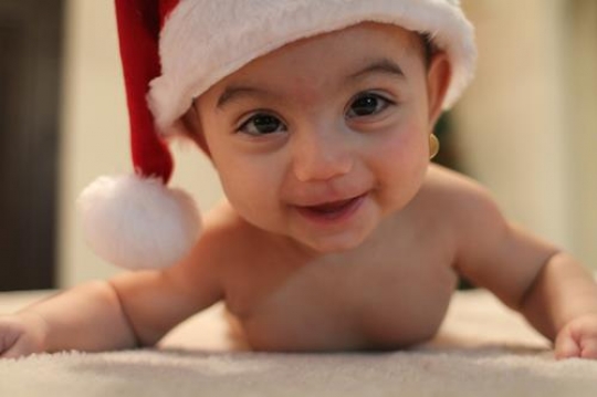 cute baby girl lying on her belly