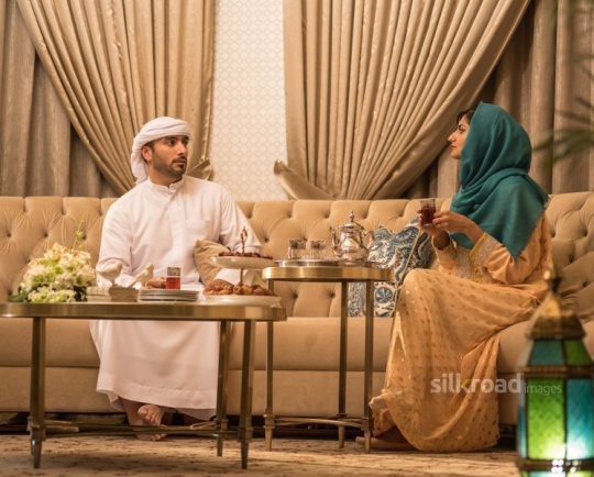 Couple in conversation over tea|-