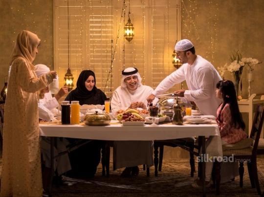 Parents serving food and drinks|-