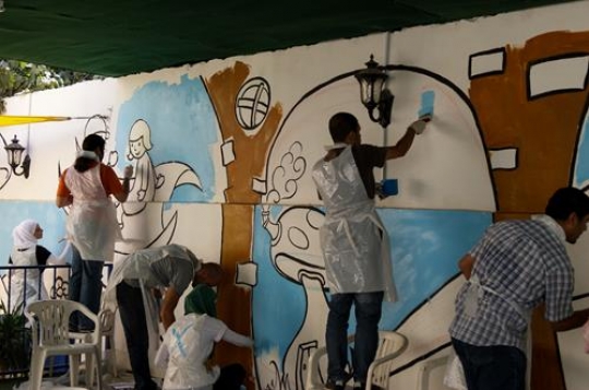 group of volunteer painting th