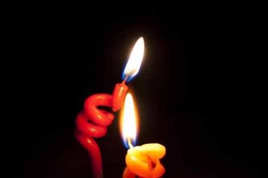 two candle with black background