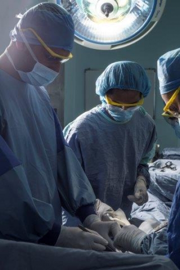 Surgeons Running an Operation