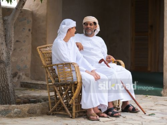 Grandfather with teenager|-