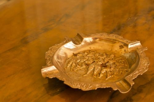 old tin ashtray