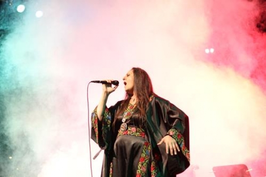 woman singing with a microphone