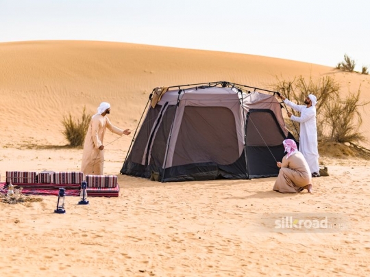 Men preparing tent