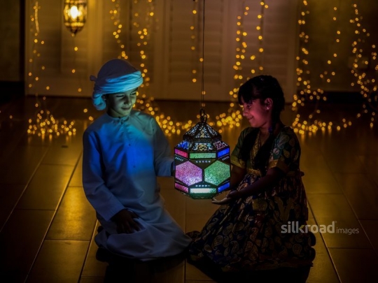 Brother and sister enjoying lantern|-